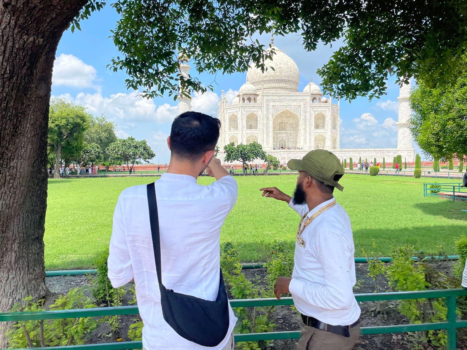 In Picture Faraj Guide explaining to Tourist about Taj Mahal