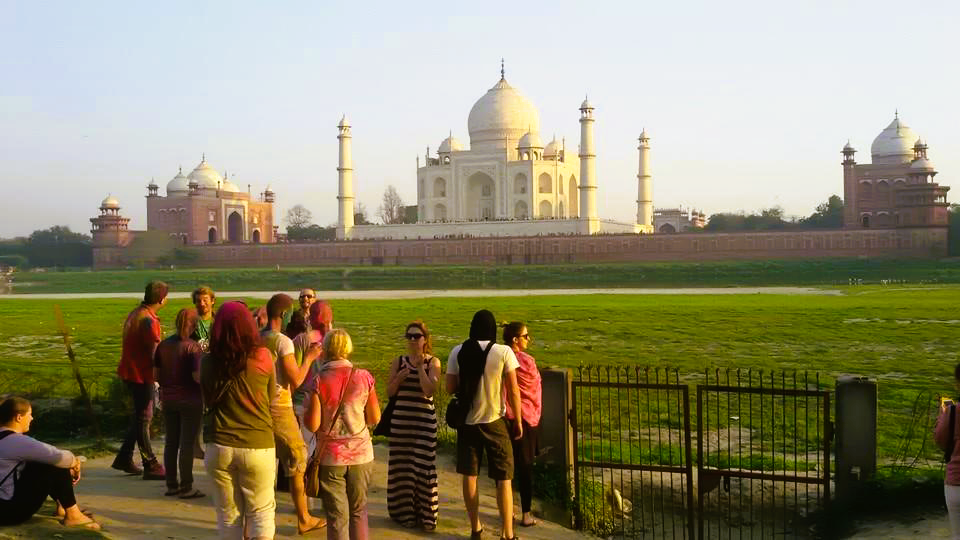 Tourists enjoying Taj Mahal view from Mehtab Bagh in summer