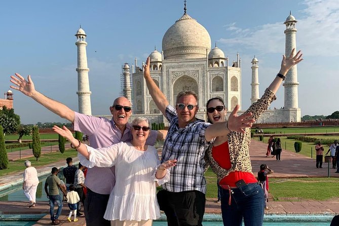 International traveler enjoying sunrise in front of the Taj Mahal during Early Morning Taj Mahal Sunrise Tour from Delhi – Tickets Included