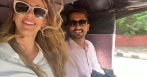 Tourist traveling from Agra Cantt Railway Station to Taj Mahal in an auto rickshaw, Agra city roads, India