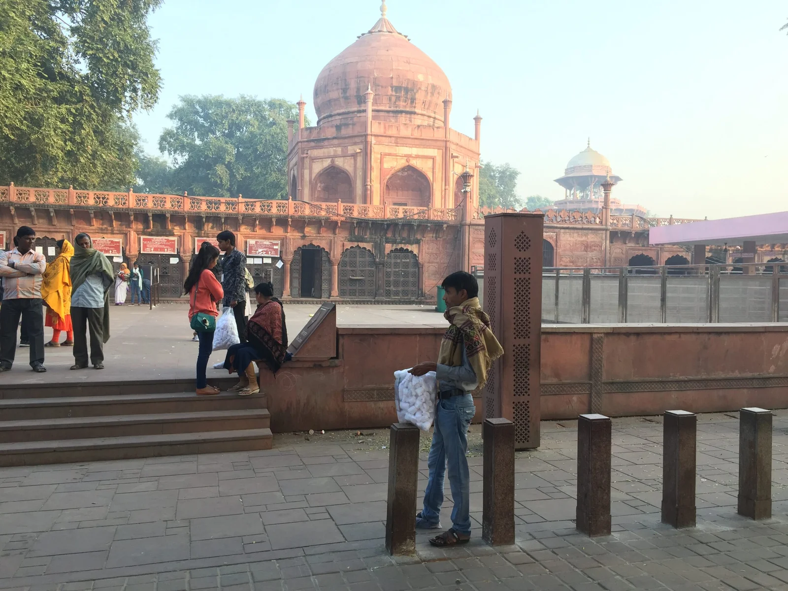 Boy selling shoe covers outside the Taj Mahal gate in Agra, India.