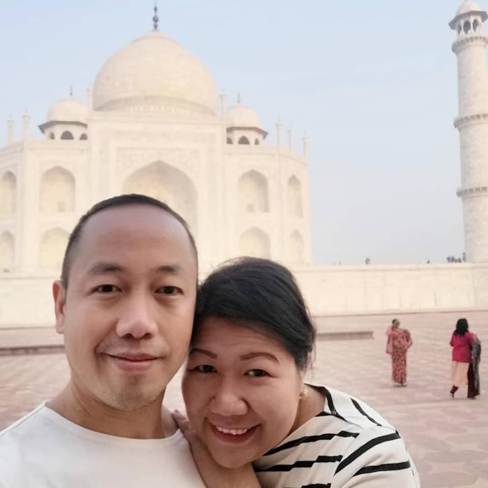 Tourists visiting the Taj Mahal with a private taxi traveling from Delhi to Agra, showing foreign travelers exploring India comfortably and safely